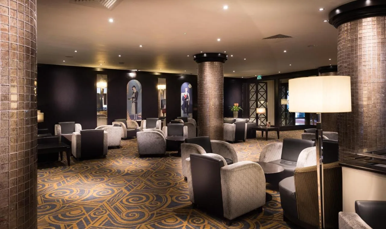 a lobby of a hotel with couches and chairs at President Hotel in London
