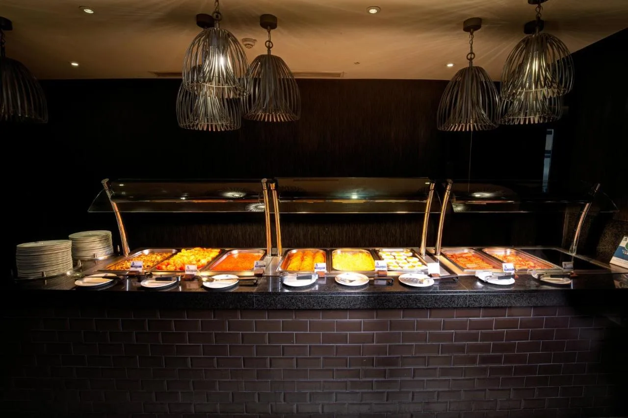 a buffet line with many different types of food at President Hotel in London